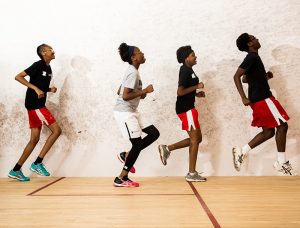 young people run in gym